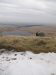 SX13032 Wouko at tent next to snow above Llyn y Fan Fawr lake.jpg